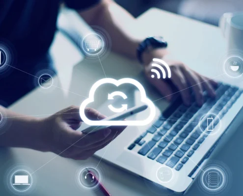 Employees using a laptop and smartphone connected through cloud communication tools