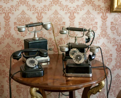 Collection of antique telephones showing the history of business communication